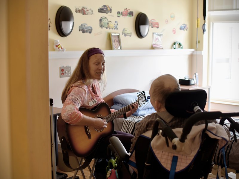We have a music therapist, who comes and works in both group settings, and one on one with clients, twice monthly