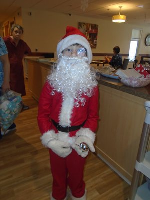 Jesse Dalling surprises the residents each winter as he dresses up as Santa Clause.jpg
